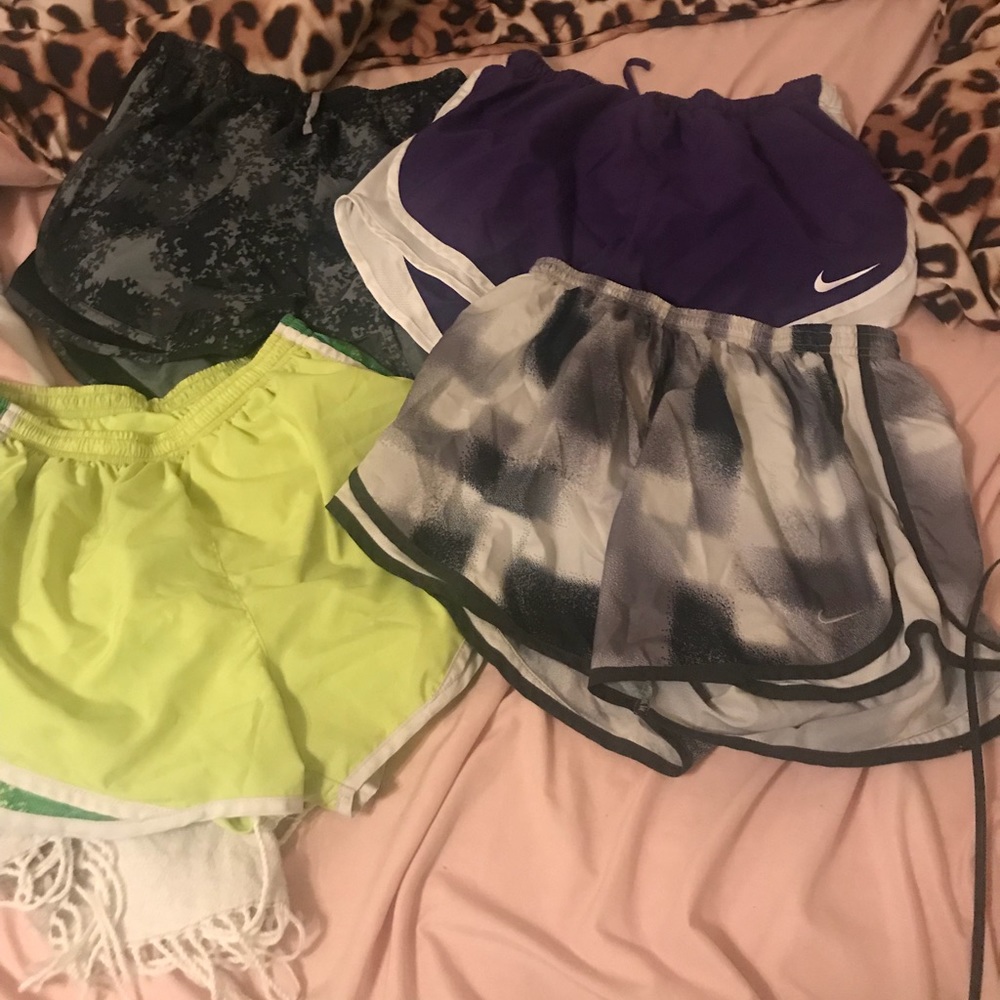 Four pairs of M Nike tempo shorts
